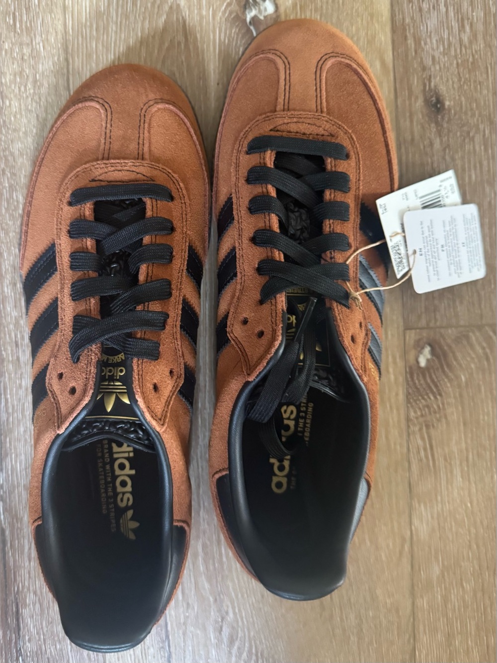 adidas Men’s Rust Suede Sneakers with Black Stripes